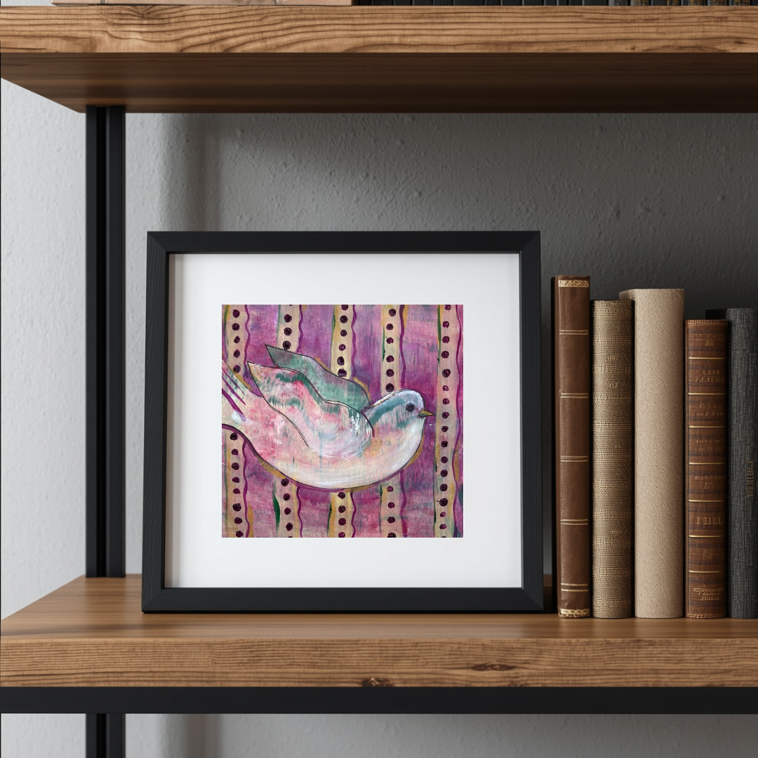 Framed artwork of a bird on a shelf with books