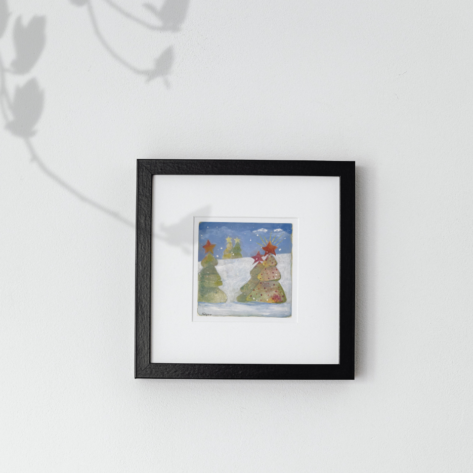 Framed artwork of a snowy landscape with trees on a white background, an original by artist Tonya Henderson.