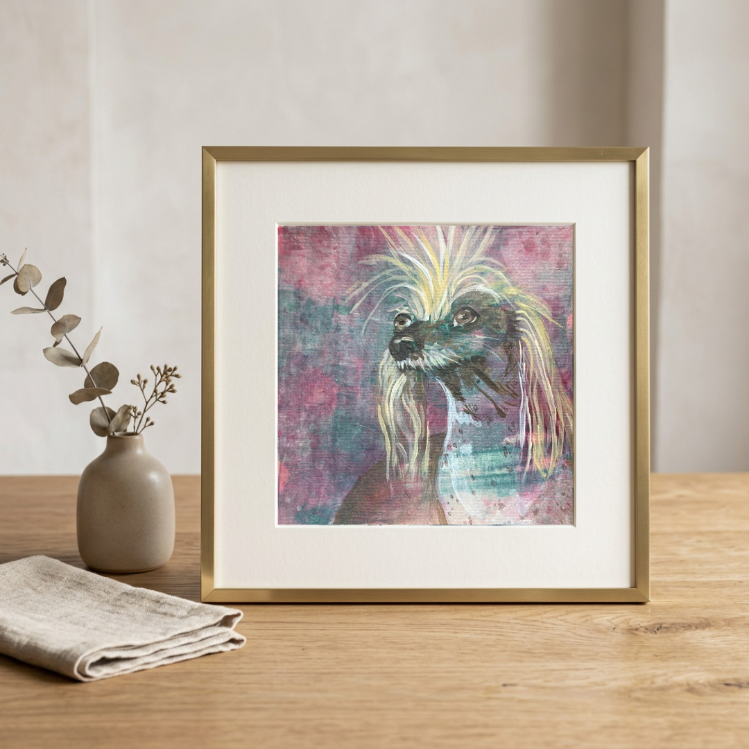 Framed abstract art print of a horse on a wooden table with a vase and cloth in the background.