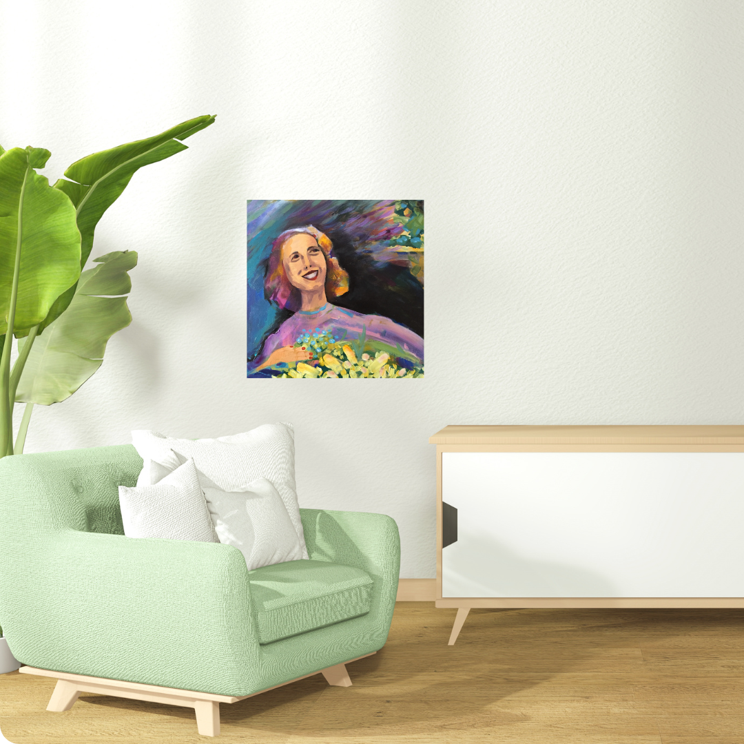 Living room with a green armchair, white pillows, and a painting of a smiling woman holding floweron the wall. By Tonya Henderson.