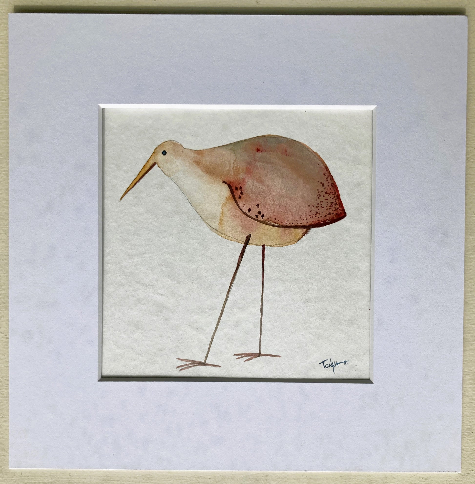 Watercolor painting of long legged beige bird with red tiped wings, red dots, and long beak.Watercolor painting of long legged beige bird with red tiped wings, red dots, and long beak. Matted in white.