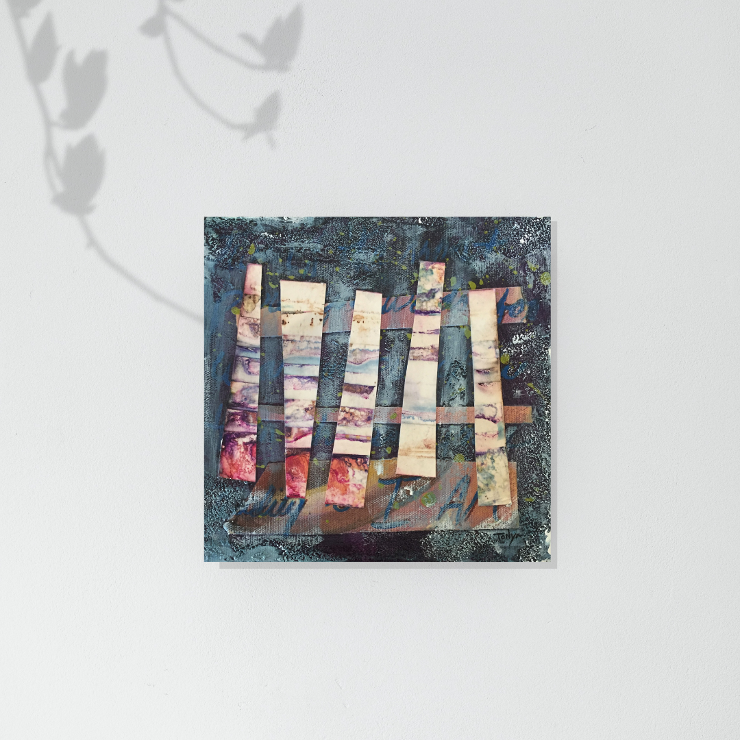 Abstract mixed media art piece with colorful rectangular shapes on a blue textured background hanging on a white wall by artist Tonya Henderson.