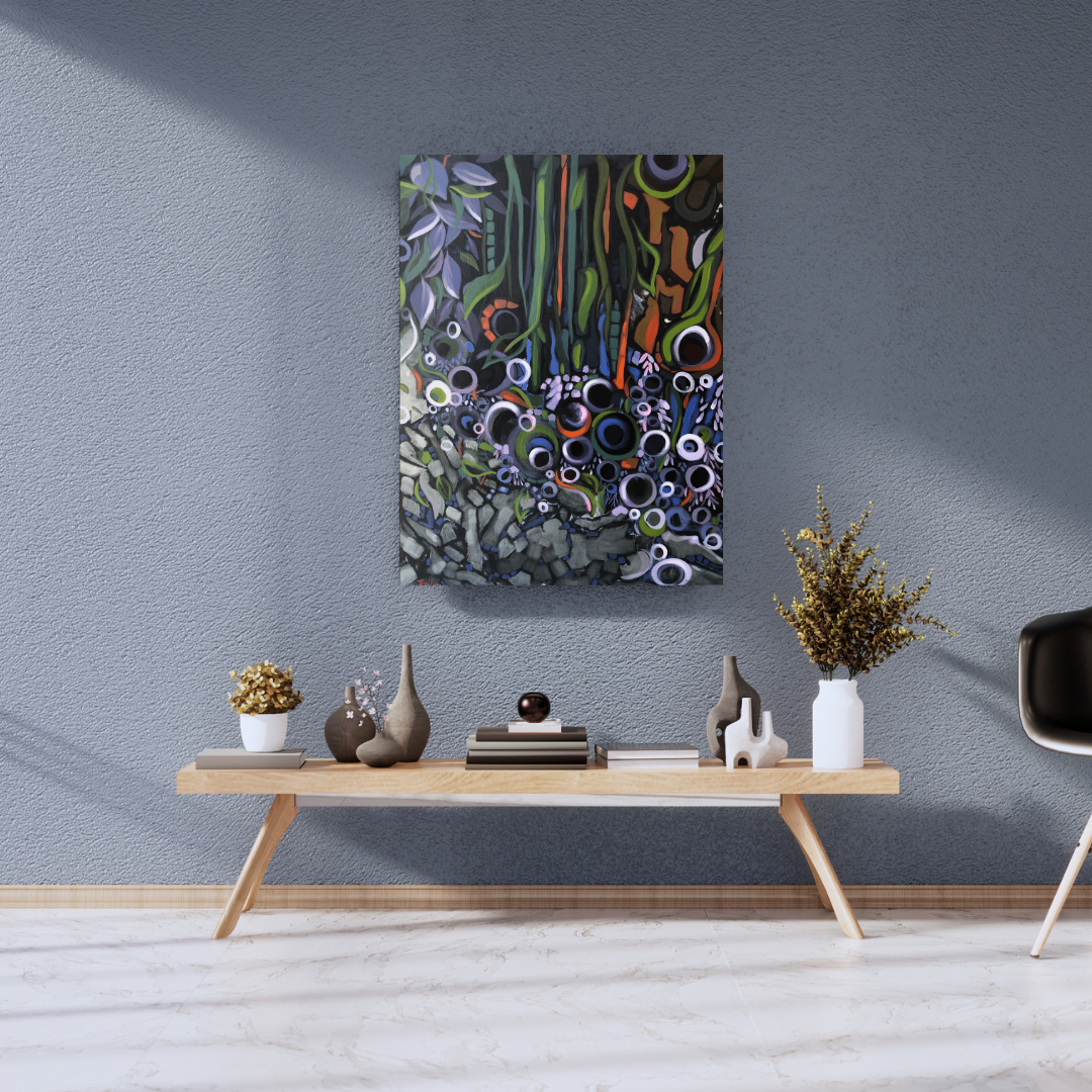Abstract nature painting on a wall above a wooden console table with decorative items. Art by Tonya Henderson.