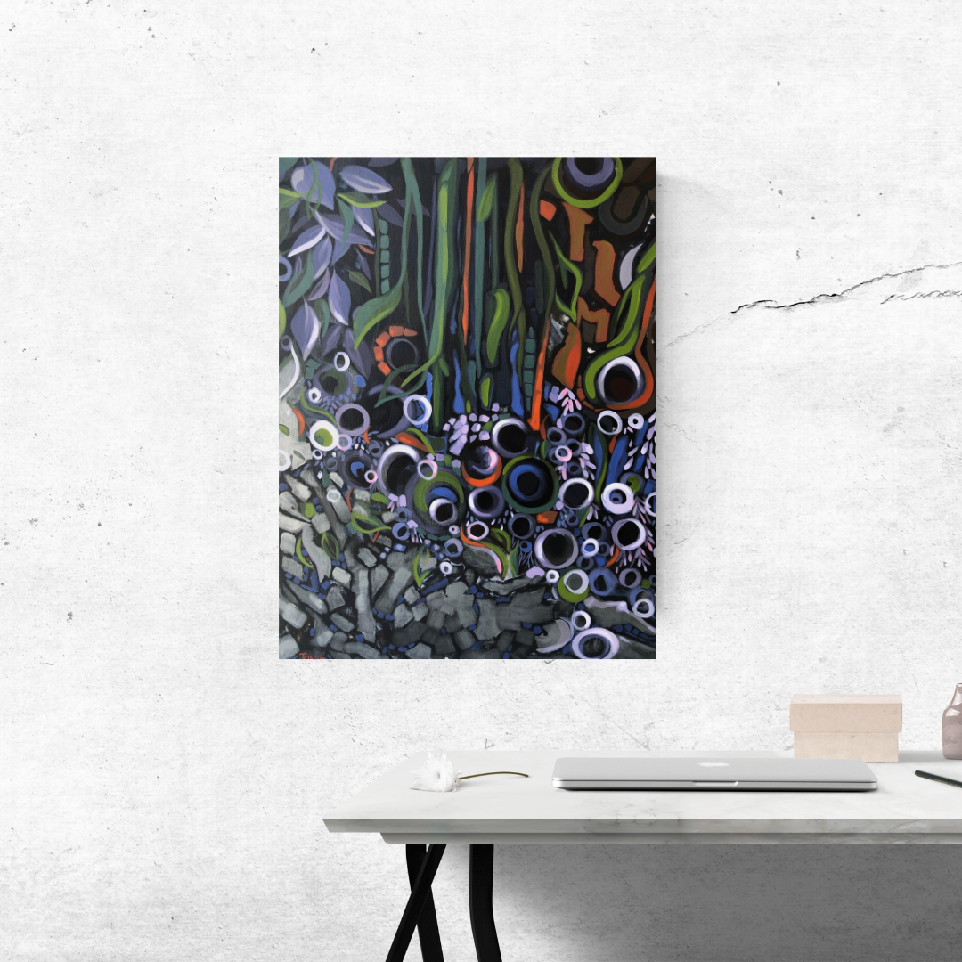 Abstract nature artwork on a white wall above a desk. Art by Tonya Henderson.