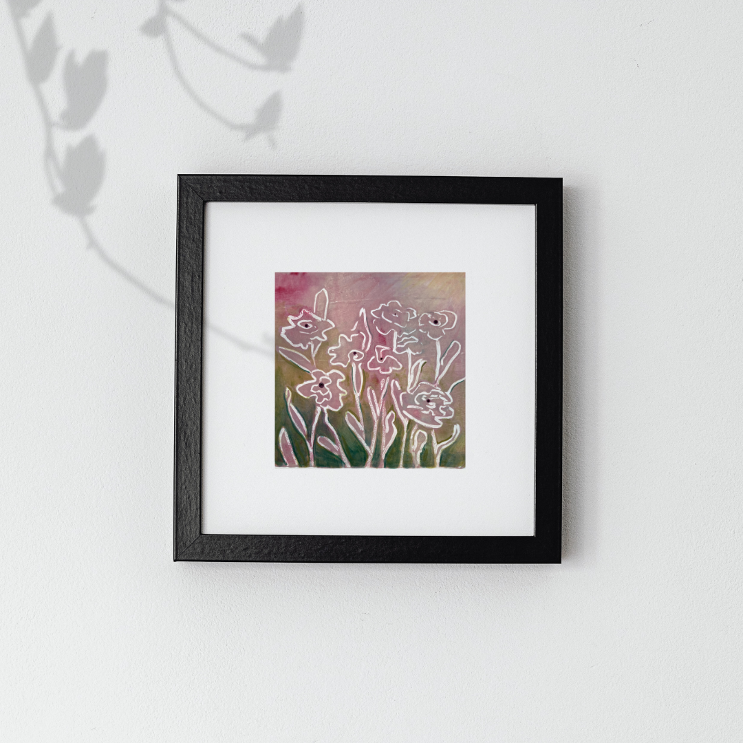 Framed artwork of floral design on a white background